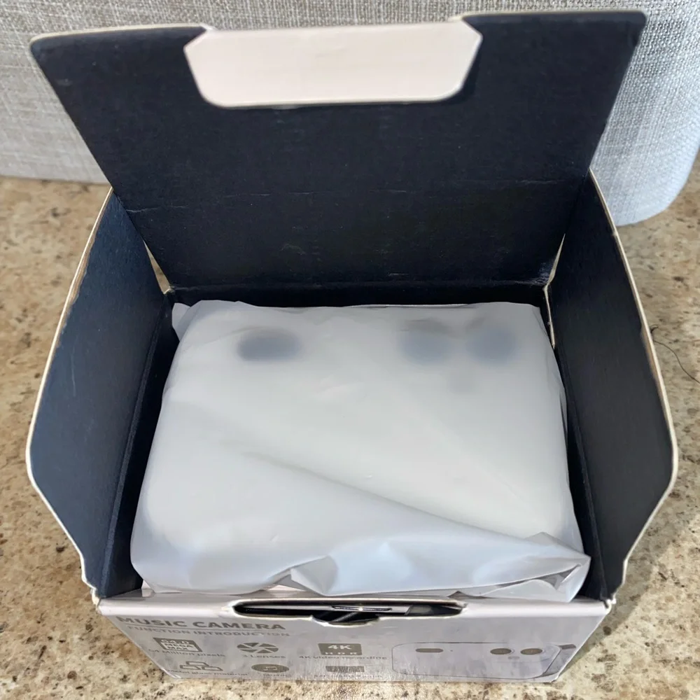 White and Black Touchscreen Music Camera